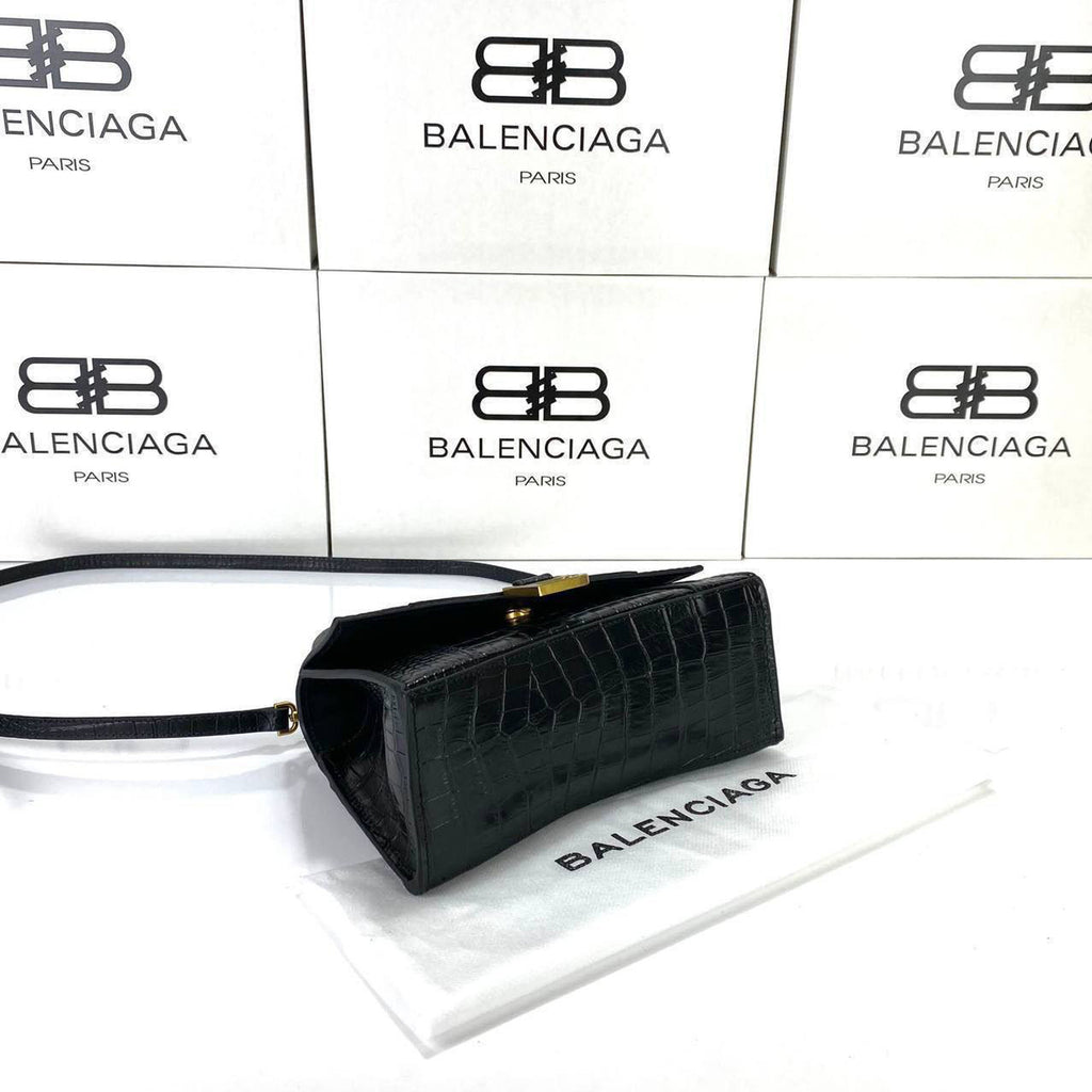 hourglass_small_handbag_crocodile_embossed_black_front_liedown_with_brand